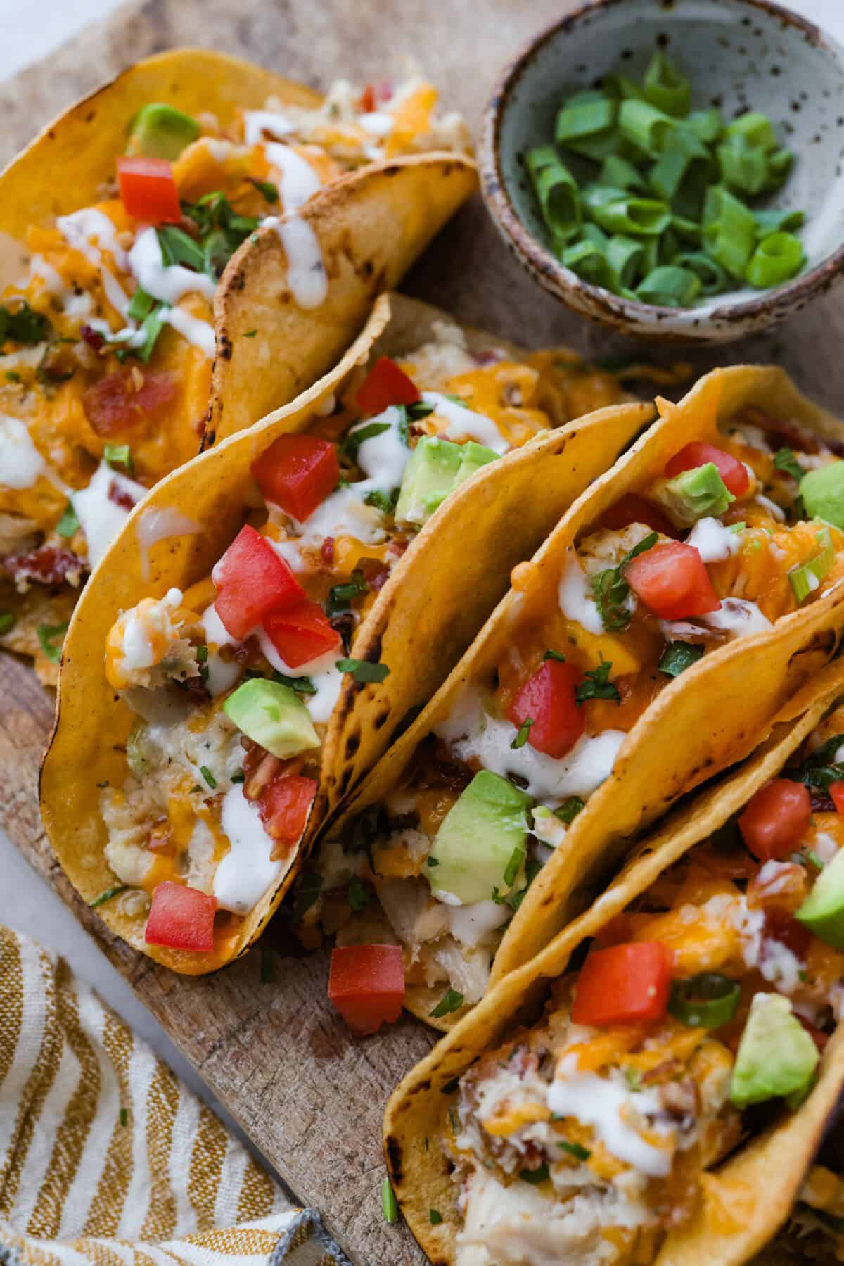 Get ready to be instantly obsessed with these crack chicken tacos! They are loaded with creamy ranch chicken, crispy bacon, and melty cheddar for a can’t-stop-eating dinner that disappears fast. Close up of crack chicken tacos.
