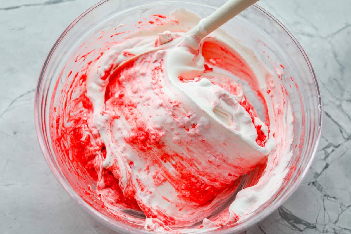 This cottage cheese jello salad is one of those old-school recipes that never really goes out of style. My dad absolutely loves it and requests it all the time, especially for family get-togethers. Itโs creamy, fruity, and ridiculously easy to make. Whipped topping added to the jello and cottage cheese mixture.