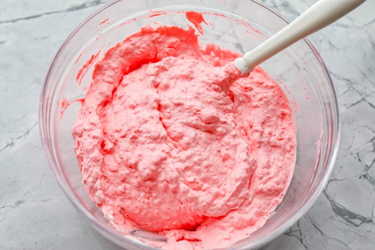 This cottage cheese jello salad is one of those old-school recipes that never really goes out of style. My dad absolutely loves it and requests it all the time, especially for family get-togethers. Itโs creamy, fruity, and ridiculously easy to make. Everything mixed together and ready to be chilled.