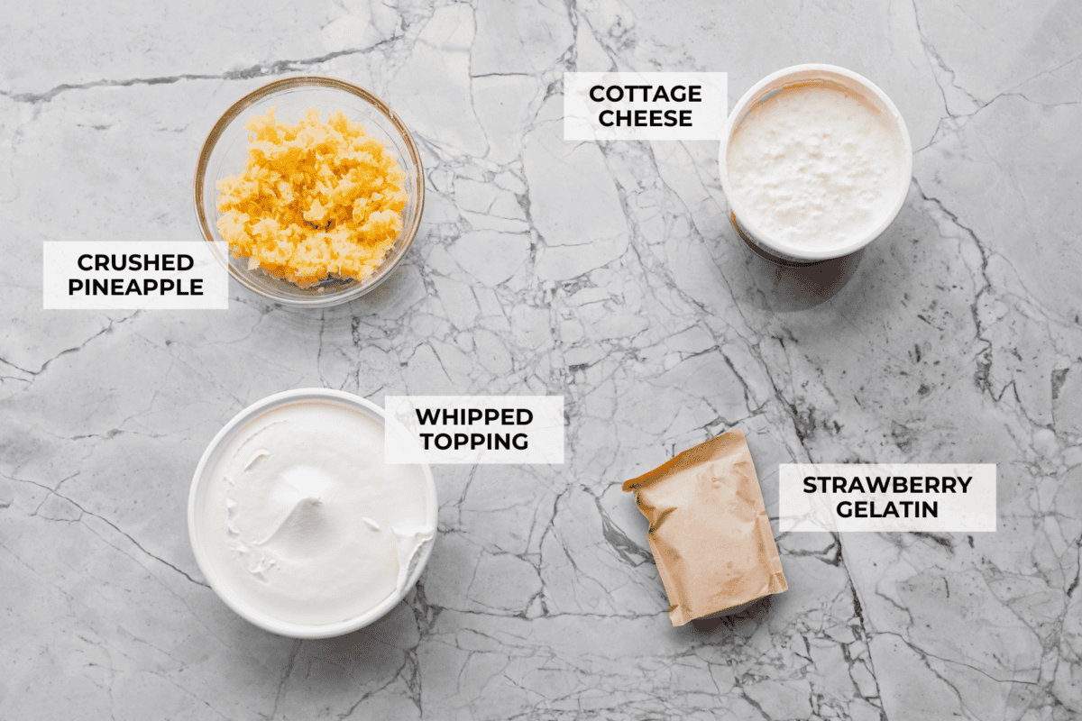 This cottage cheese jello salad is one of those old-school recipes that never really goes out of style. My dad absolutely loves it and requests it all the time, especially for family get-togethers. Itโs creamy, fruity, and ridiculously easy to make. Overhead shot of labeled ingredients.