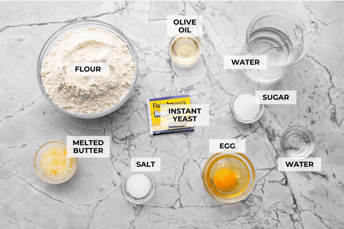If warm, homemade bread is your weakness, youโre going to love these French bread rolls. Theyโre soft, chewy, and perfect for everything from weeknight dinners to holiday meals. Overhead shot of labeled ingredients.