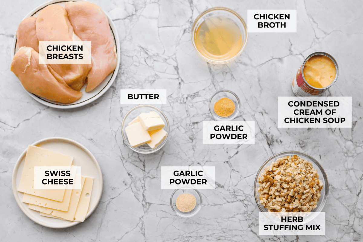 Okay, this Swiss Chicken Casserole is my go-to when I donโt feel like cooking. You basically throw it together, pop it in the oven, and somehow end up with super tender chicken, melty Swiss cheese, and the creamiest sauce. Overhead shot of labeled ingredients.