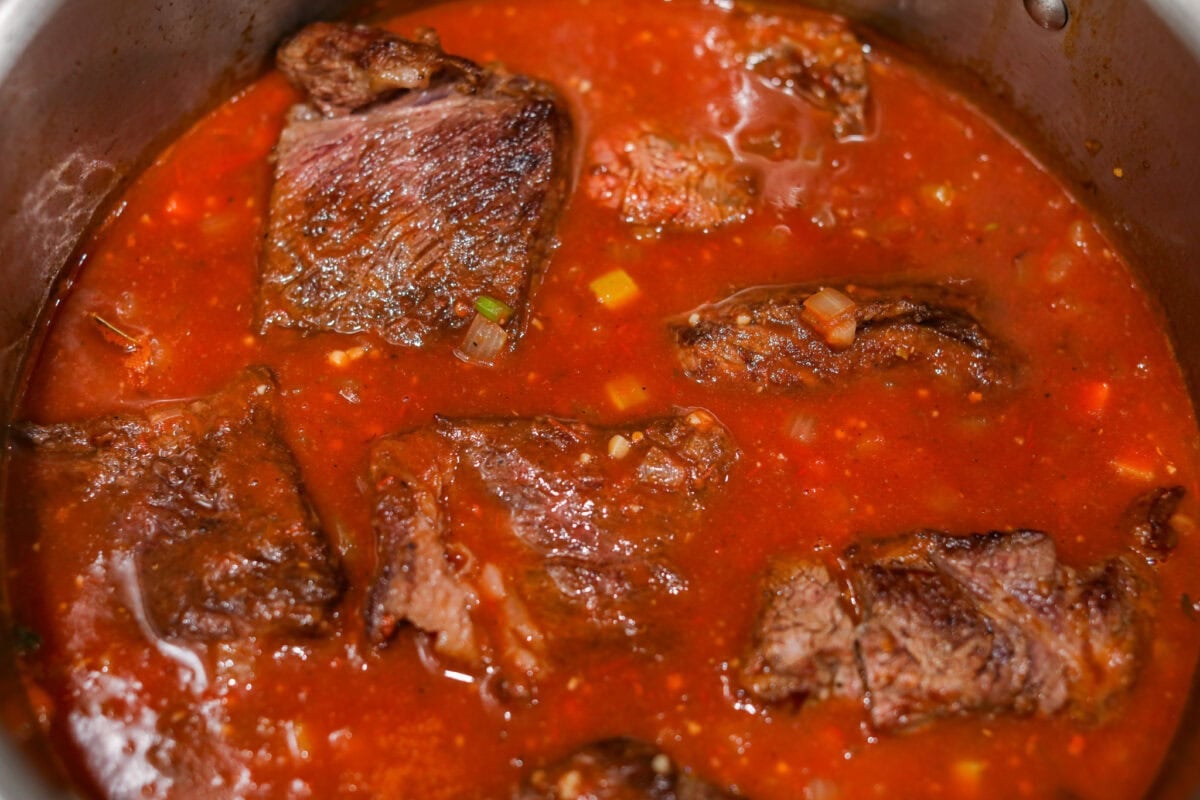 Beef added to the pot and ready to go in the oven.