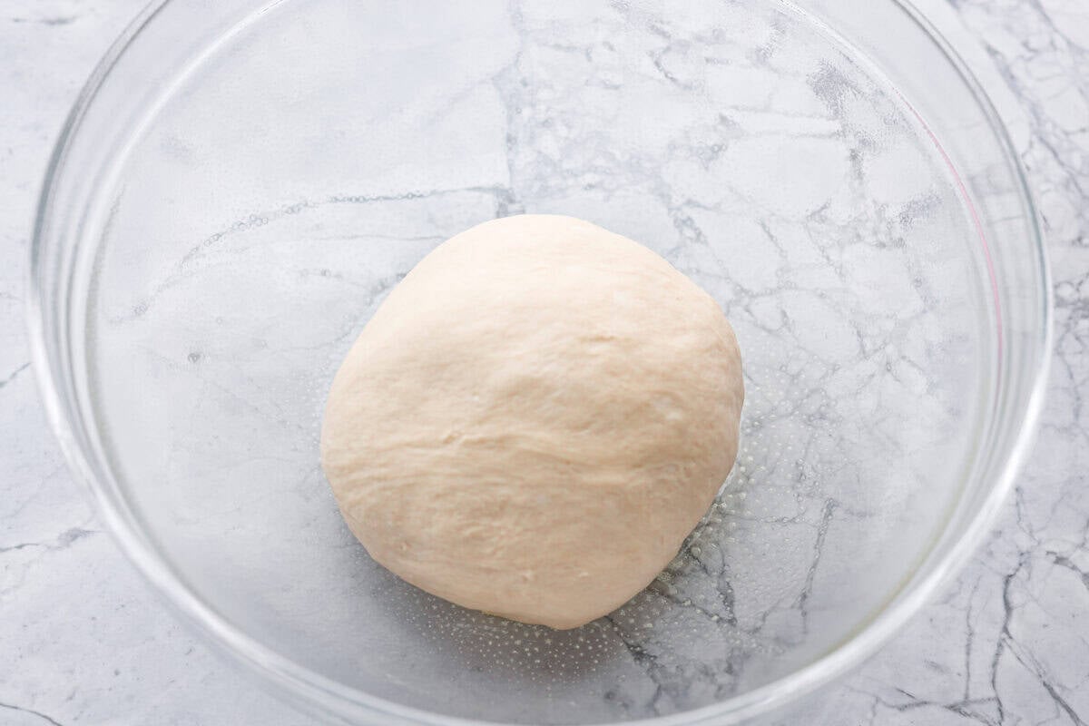 If you’ve ever wanted homemade bread without all the work, this slow cooker bread is my favorite easy trick. As a busy mom, I love that a few simple ingredients and my slow cooker turn into a warm, soft loaf with hardly any effort. Ball of dough in a bowl.