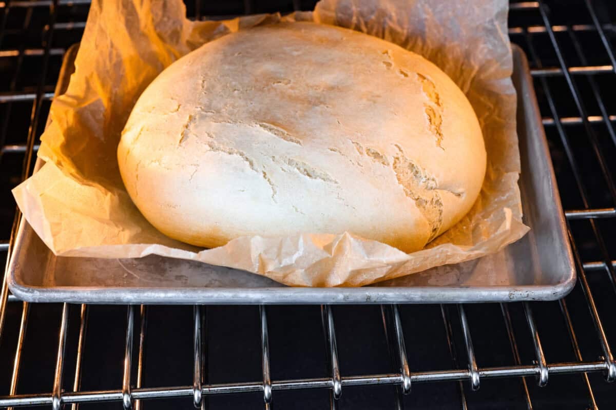 If you’ve ever wanted homemade bread without all the work, this slow cooker bread is my favorite easy trick. As a busy mom, I love that a few simple ingredients and my slow cooker turn into a warm, soft loaf with hardly any effort. Cooked slow cooker bread in the oven to get a golden crust on the top.
