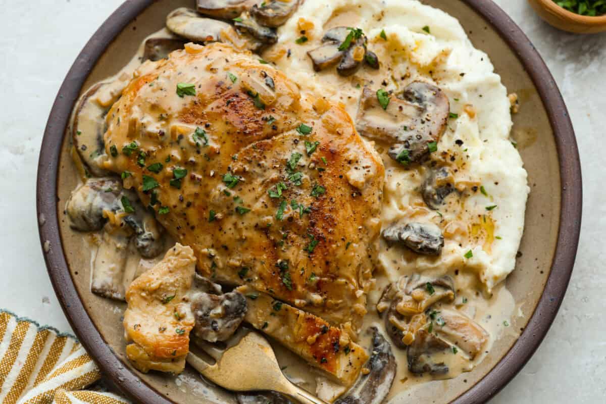 Plated chicken Diane with mashed potatoes.