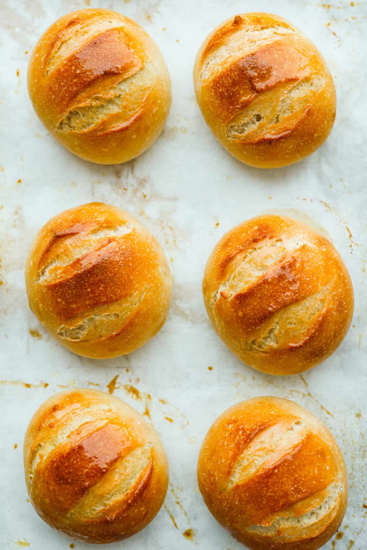 If warm, homemade bread is your weakness, youโre going to love these French bread rolls. Theyโre soft, chewy, and perfect for everything from weeknight dinners to holiday meals. French bread rolls freshly baked and cooling on the counter.