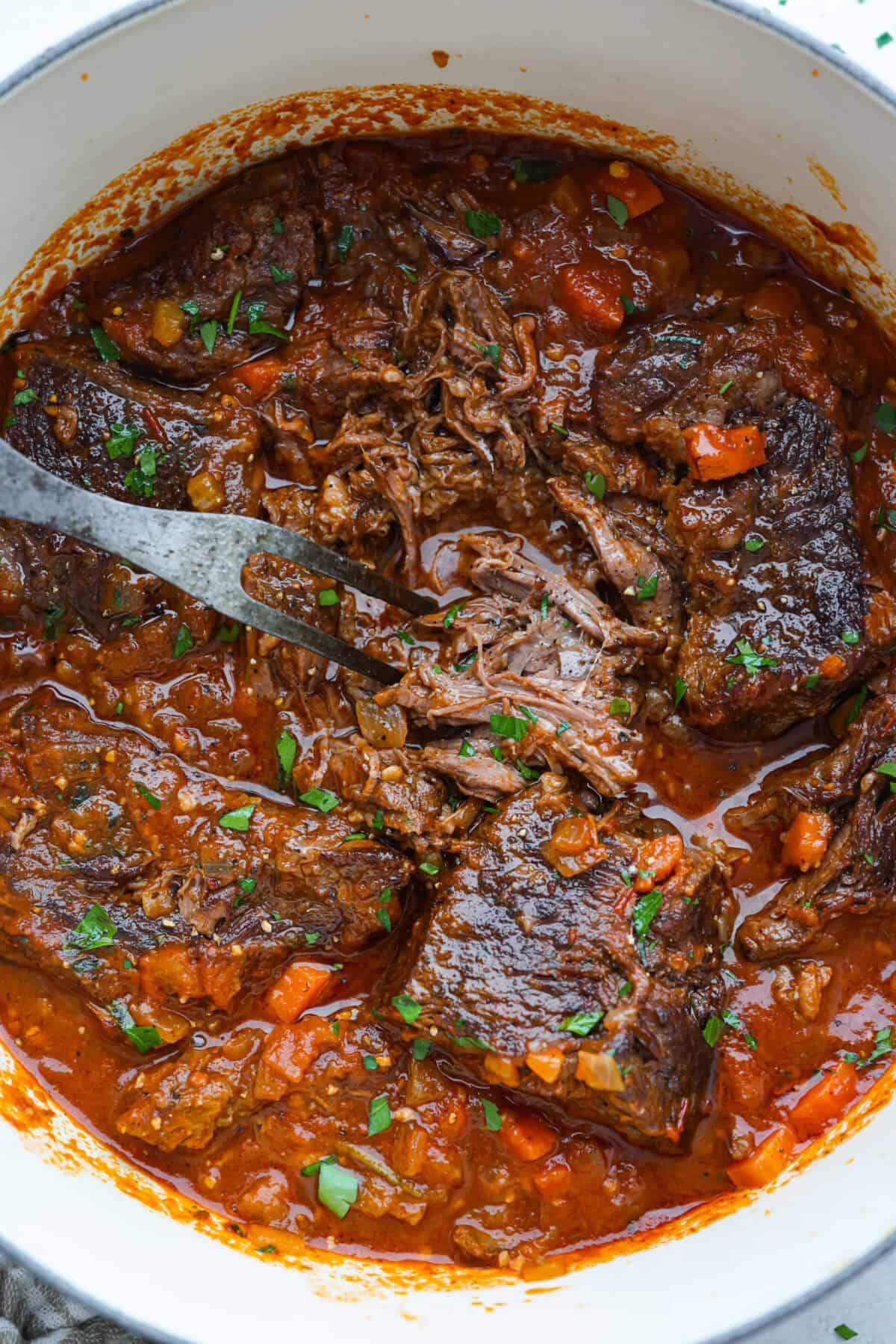Overhead shot of Italian pot roast all cooked and fall apart tender. 