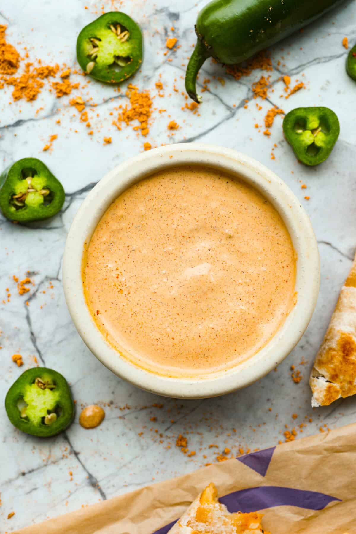 Serve: Enjoy with fresh quesadillas or use as a dipping sauce for your favorite Tex-Mex meals.ย I love this sauce drizzled over chicken burrito bowls! Overhead shot of a bowl of sauce.