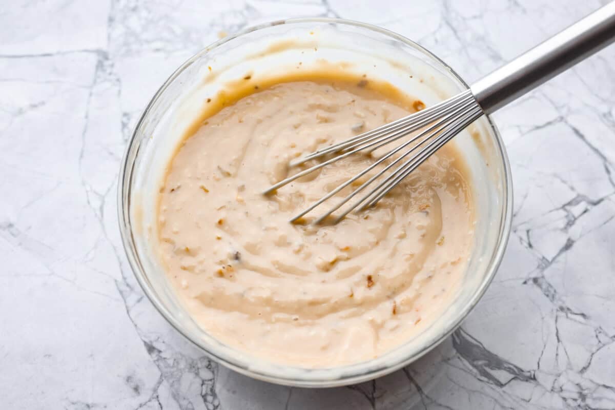 This 4 Ingredient Mushroom Beef is just like how my grandma used to make her Sunday roast, simple and cozy. You toss it all in the crockpot, and it comes out melt in your mouth tender with a rich gravy thatโs perfect over everything. Gravy ingredients whisked together in a bowl.