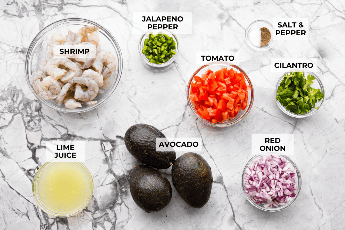 If you're anything like me, you LOVE shrimp ceviche! My version has avocado and is fresh, bright, and has the most incredible flavor. It's the perfect no-cook dish for warm weather. Make it, trust me, you will thank me later! Overhead shot of labeled shrimp ceviche ingredients.