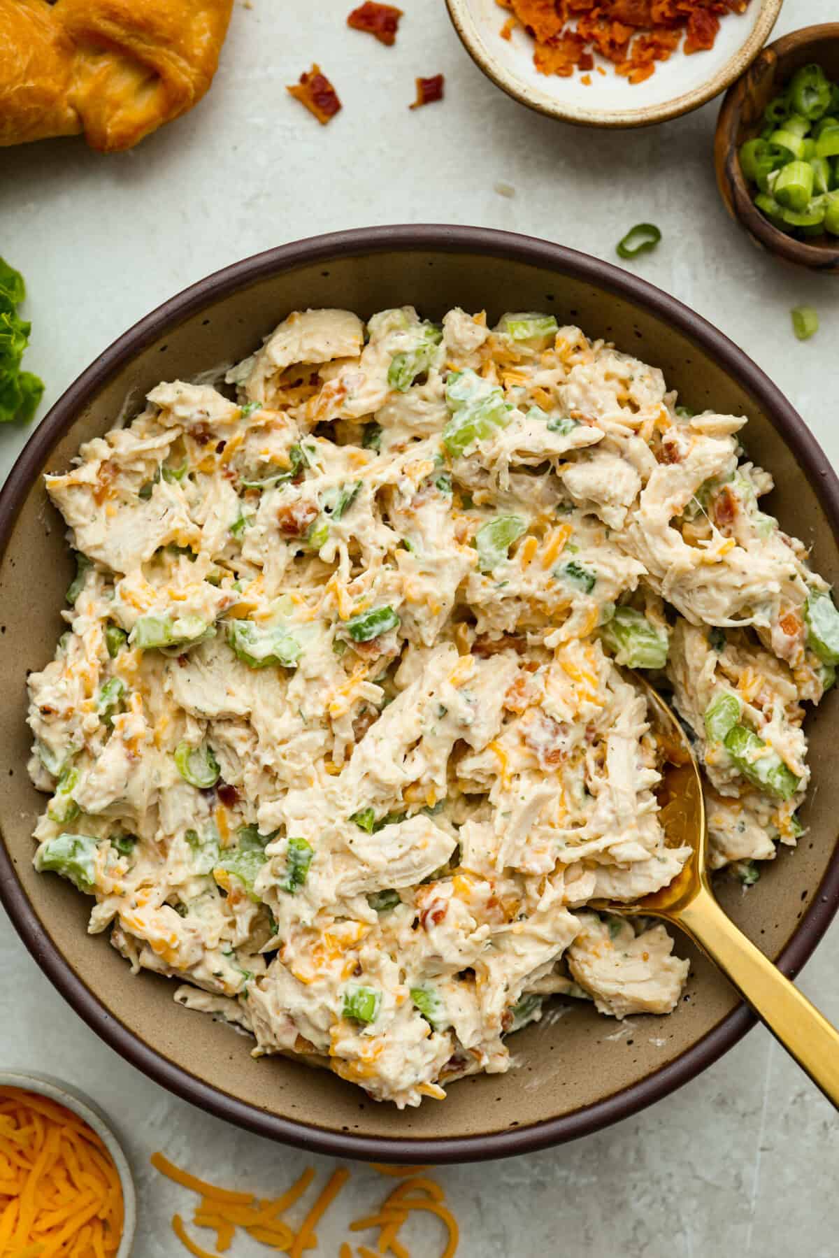 This crack chicken salad has no business being this good! Itโs creamy, packed with ranch, bacon, and cheddar, and disappears way too fast. Pile it on a croissant or eat it straight from the bowl. I promise I won't judge! Bowl of crack chicken salad.