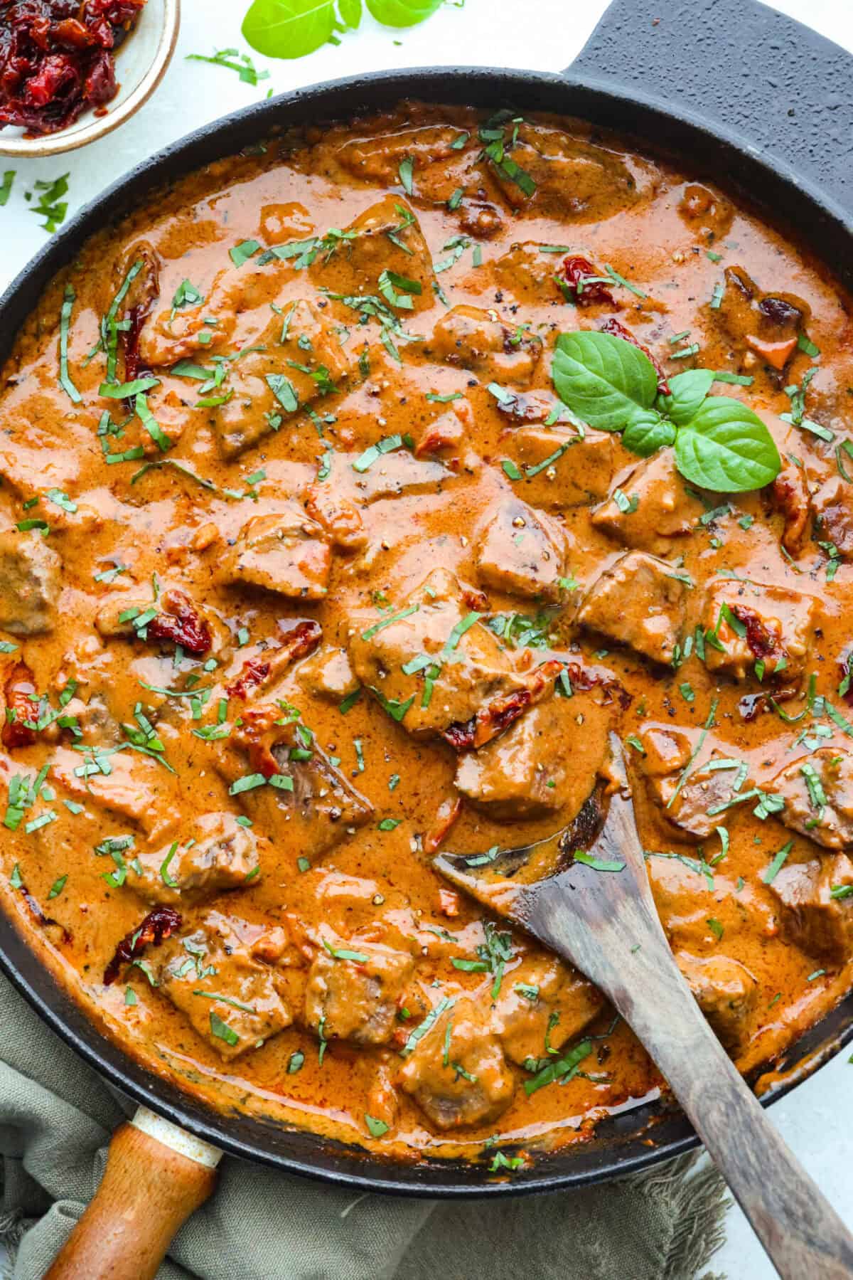 These marry me steak bites bring the flavor! Juicy, seared steak is tossed in a rich, creamy sauce with sun-dried tomatoes and bold, layered flavor. They're quick to make and perfect for spooning over potatoes or soaking up with veggies. Skillet full of ready to eat marry me steak bites in a delicious Tuscan inspired sauce.