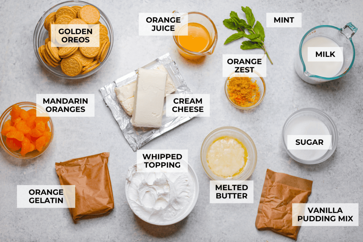 Orange creamsicle lush is sunshine in dessert form! With creamy orange layers, a buttery golden Oreo crust, and bright fresh citrus flavor, this easy no-bake dessert is a fun twist on my popular Lemon Lush thatโs perfect for summer. Overhead shot of labeled orange creamsicle lush ingredients.