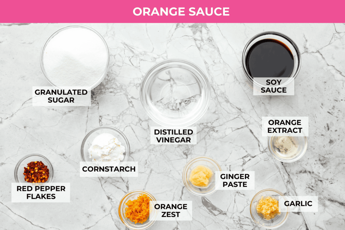 Skip the drive-thru and make this copycat Panda Express orange chicken at home! Crispy chicken coated in a sweet, sticky orange sauce with a secret ingredient that makes it taste just like the real thing. Perfect for an easy takeout-style dinner the whole family will love. Overhead shot of labeled orange sauce ingredients.