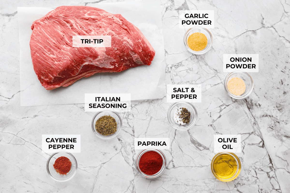 Santa Maria grilled tri-tip is juicy, smoky, and loaded with bold flavor from a delicious spice rub. Grilled until perfectly tender with a gorgeous crust, itโs an easy recipe thatโs always a hit at cookouts and summer dinners. Overhead shot of labeled Santa Maria tri-tip ingredients.