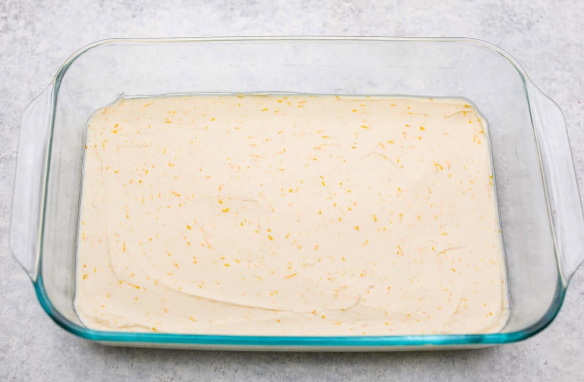 Orange creamsicle lush is sunshine in dessert form! With creamy orange layers, a buttery golden Oreo crust, and bright fresh citrus flavor, this easy no-bake dessert is a fun twist on my popular Lemon Lush thatโs perfect for summer. Cream cheese mixture in the bottom of the 9x13 dish.