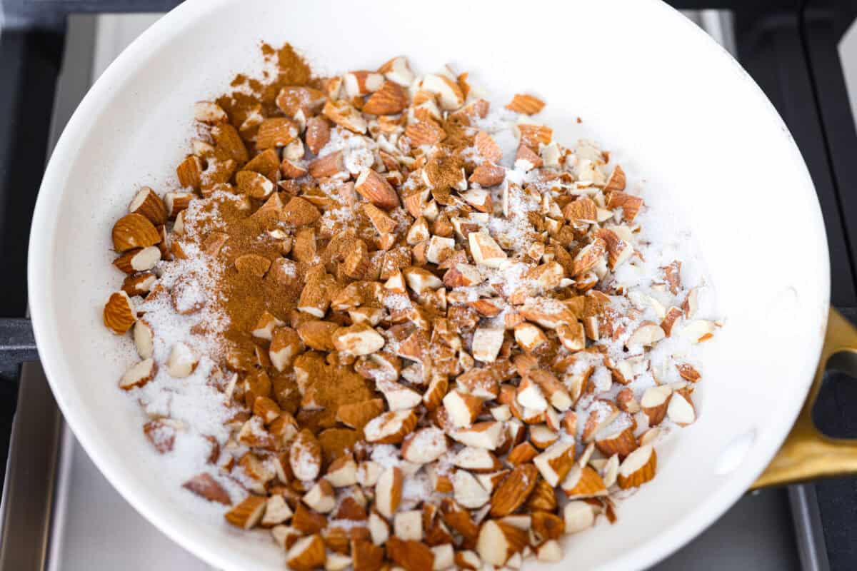 This copycat Zupa’s Nuts About Berries Salad is fresh, bright, and full of texture in every bite. Loaded with sweet berries, crunchy cinnamon almonds, crisp greens, and creamy poppyseed dressing, it tastes just like the restaurant favorite right at home! Pan with sugar, cinnamon, and almonds.