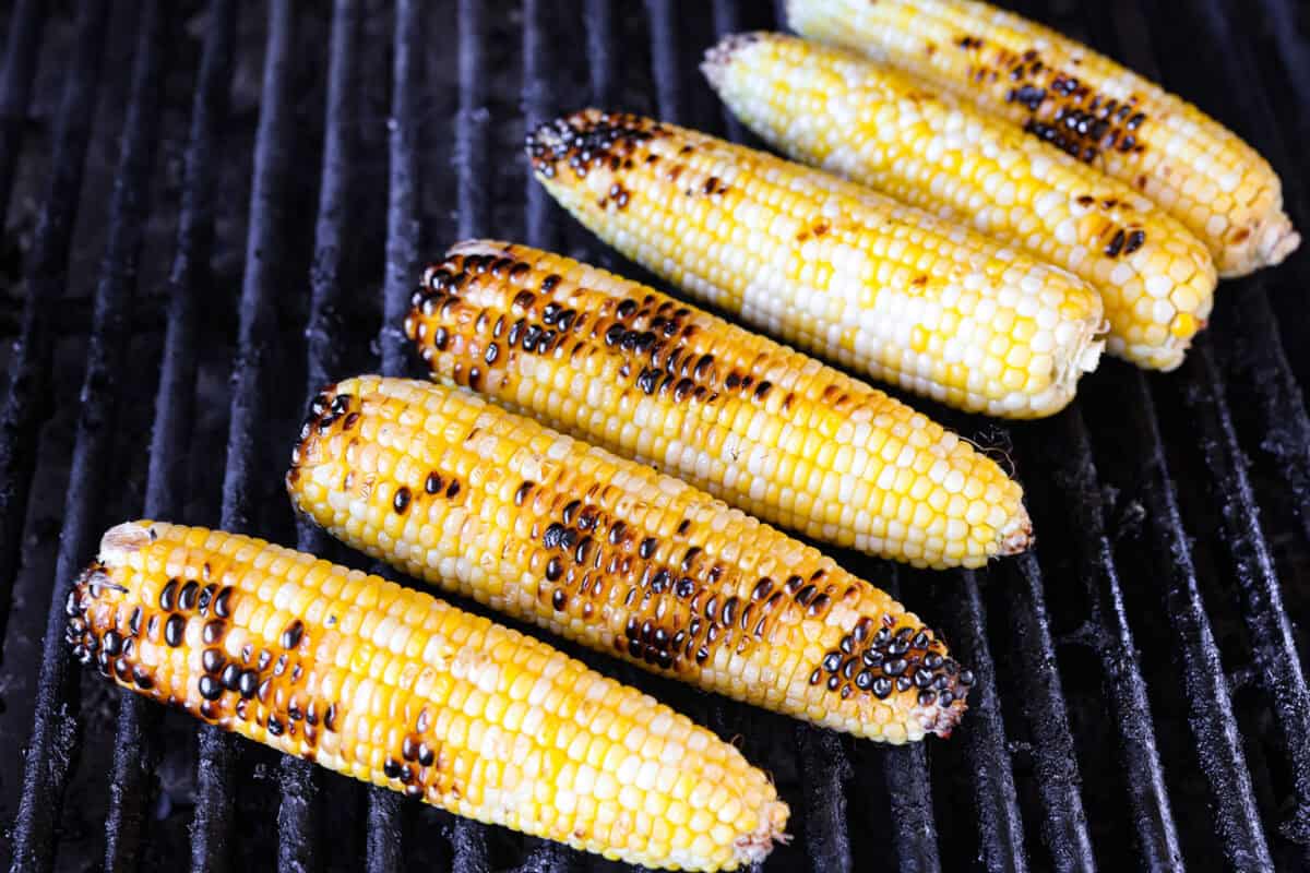 Grilled corn is simple and so versatile. Eat it straight off the cob with butter, cut it intoย salads,ย casseroles, or serve it chilled. The sweet kernels with a touch of smoky char are pure summer heaven. 6 ears of corn on a hot grill.