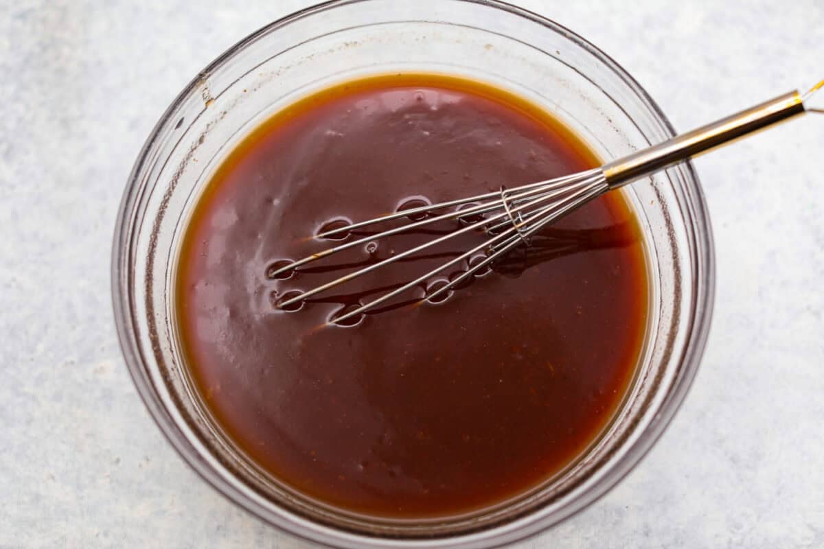 Don't be surprised if these Hawaiian Lil' Smokies steal the show! Slow cooked in a sweet and tangy pineapple BBQ sauce, they're bite-sized, irresistible, and dangerously easy to snack on. Sauce ingredients whisked together in a bowl.