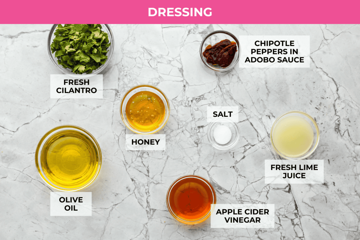 I love salads in the summer, and this grilled shrimp salad is such a good one. Itโs fresh, colorful, and filling without feeling heavy. And the dressing? Oh my gosh. The chipotle-lime flavor is so good, youโll want to pour it on everything. Overhead shot of labeled dressing ingredients.