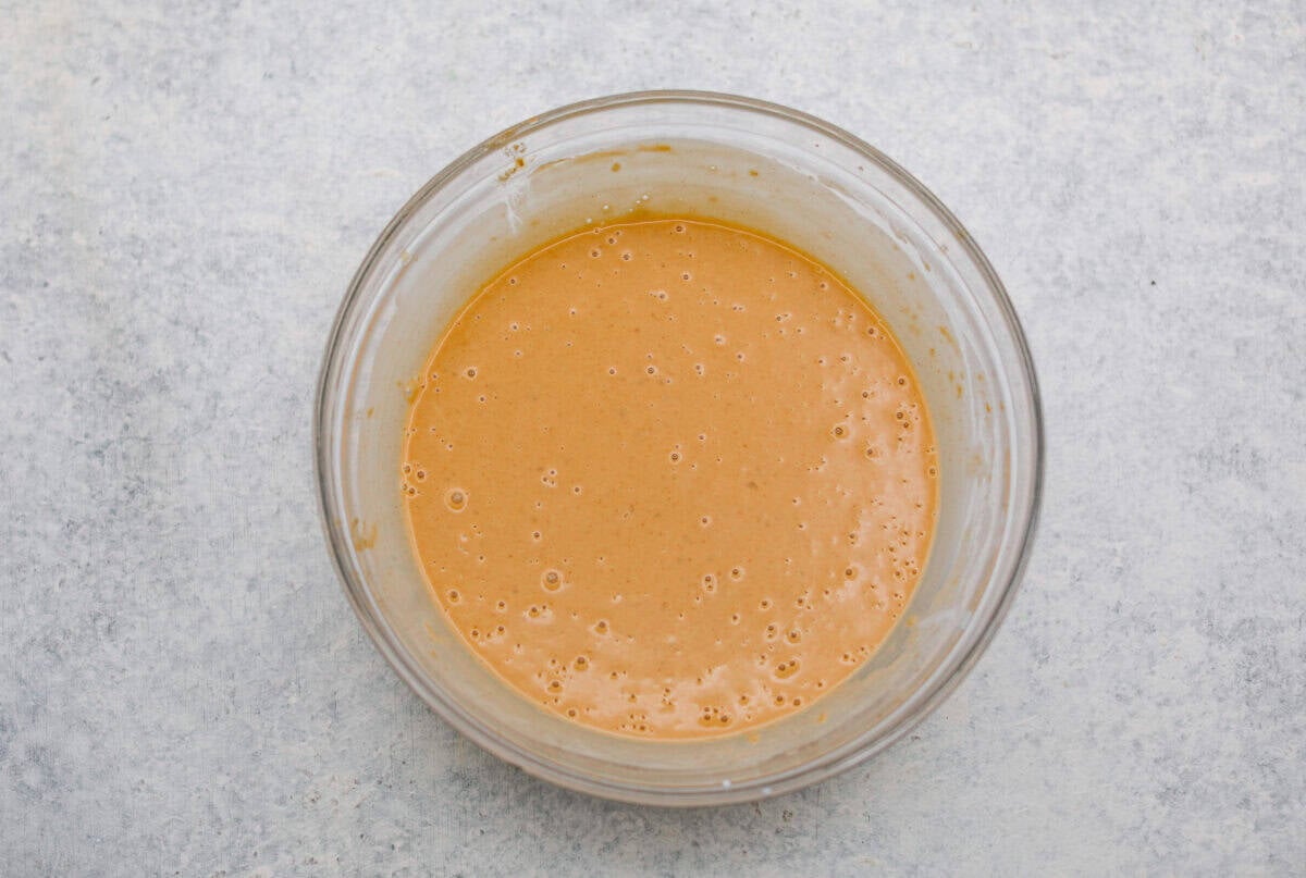 You asked, I listened! This slow cooker Thai peanut chicken got a serious glow-up! The sauce is creamy, savory, a little sweet, and packed with peanut coconut flavor. Iโd drink it with a straw if that were socially acceptable, but spooning it over rice, noodles or adding it to lettuce wraps is probably the better dinner move. Sauce ingredients whisked together in a bowl.