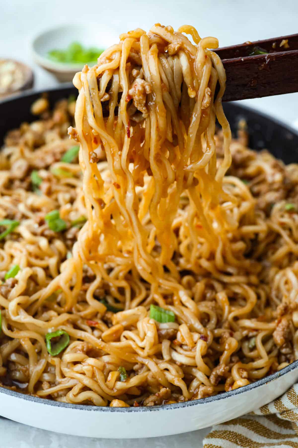 These dragon noodles are the ultimate weeknight dinner when youโre craving big flavor fast. Tender noodles, spicy-sweet sauce, and savory pork come together for a dish thatโs fast, fiery, and seriously addictive. Meat and sauce mixture combined with the cooked dragon noodles.
