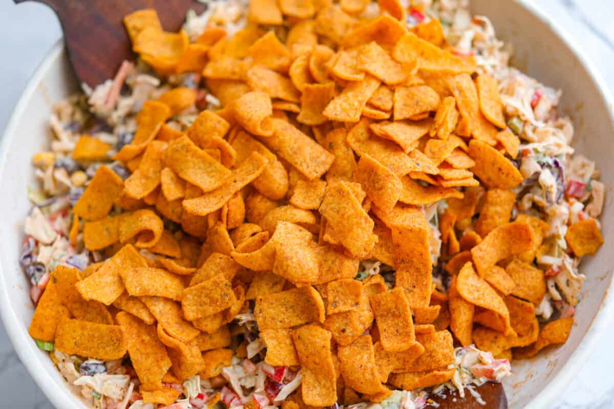 Chili Cheese Fritos added to the mixed up coleslaw. 