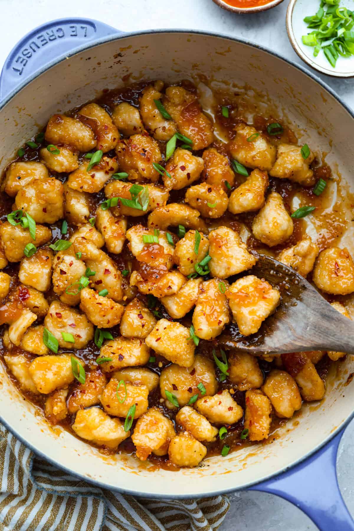 Skillet with sticky apricot chicken cooked and ready to eat. 