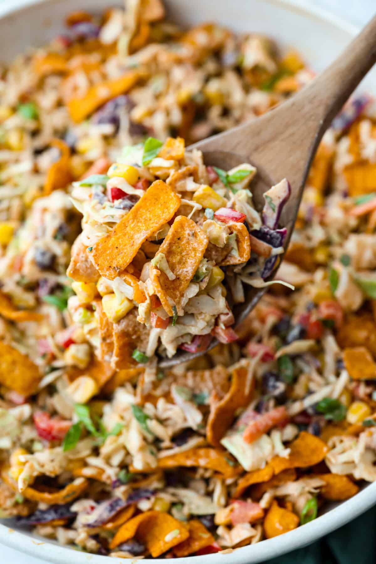 Close up of a scoop of cowboy coleslaw. 