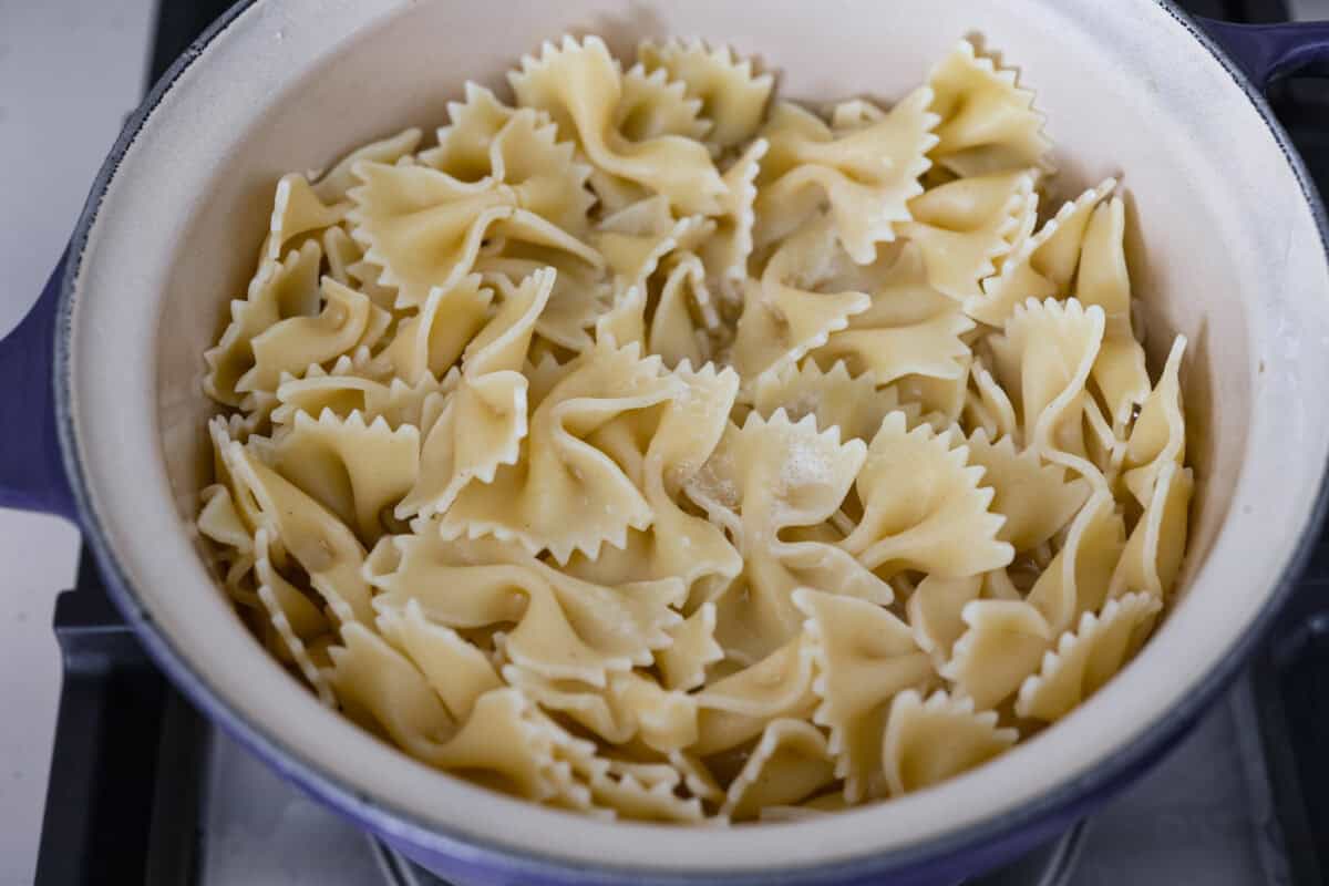 Cooked pasta in a pot on the stove. 