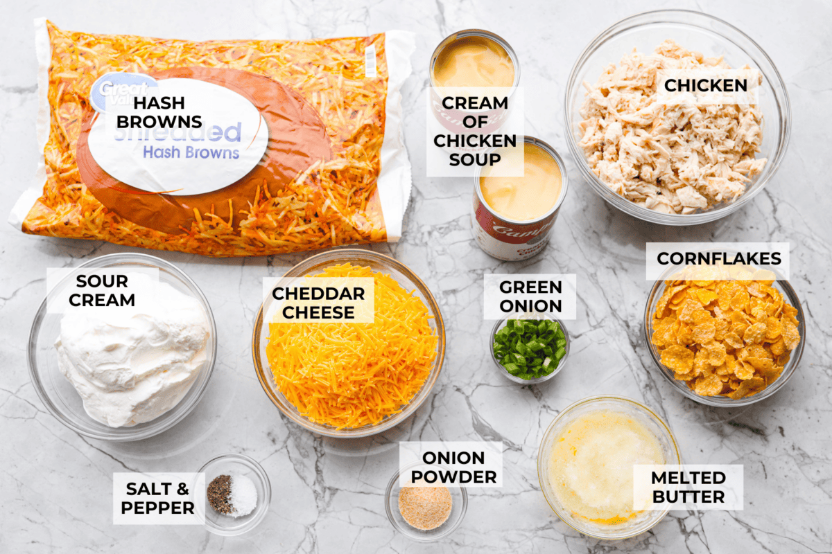 My funeral potato and chicken casserole turns the classic cheesy side dish into a complete dinner. It’s creamy, comforting, and packed with tender chicken, potatoes, and plenty of cheese. Overhead shot of labeled funeral potato and chicken casserole ingredients.