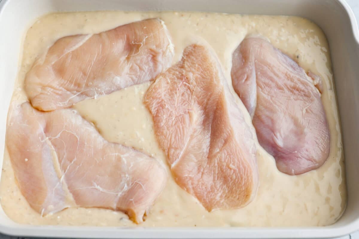 chicken and rice casserole could not be easier Chicken breasts added over the top of the sauce then seasoned.