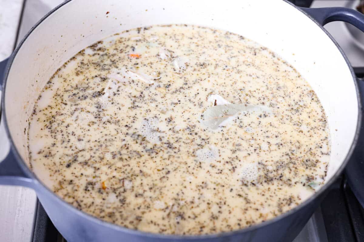 Chicken and dumpling soup will have everyone racing to the table! This one-pot dinner is loaded with tender chicken, hearty vegetables, and a creamy broth. Soft homemade dumplings steam right on top for the perfect finishing touch. Chicken broth and evaporated milk added to the pot.